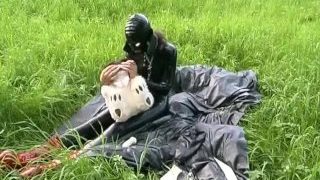 Rubber Girl Full In Black Latex Catsuit And Mask Plays With Herself Outdoor In A Meadow – Part 1