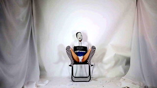 Girl's skirt wearing a Noh mask
